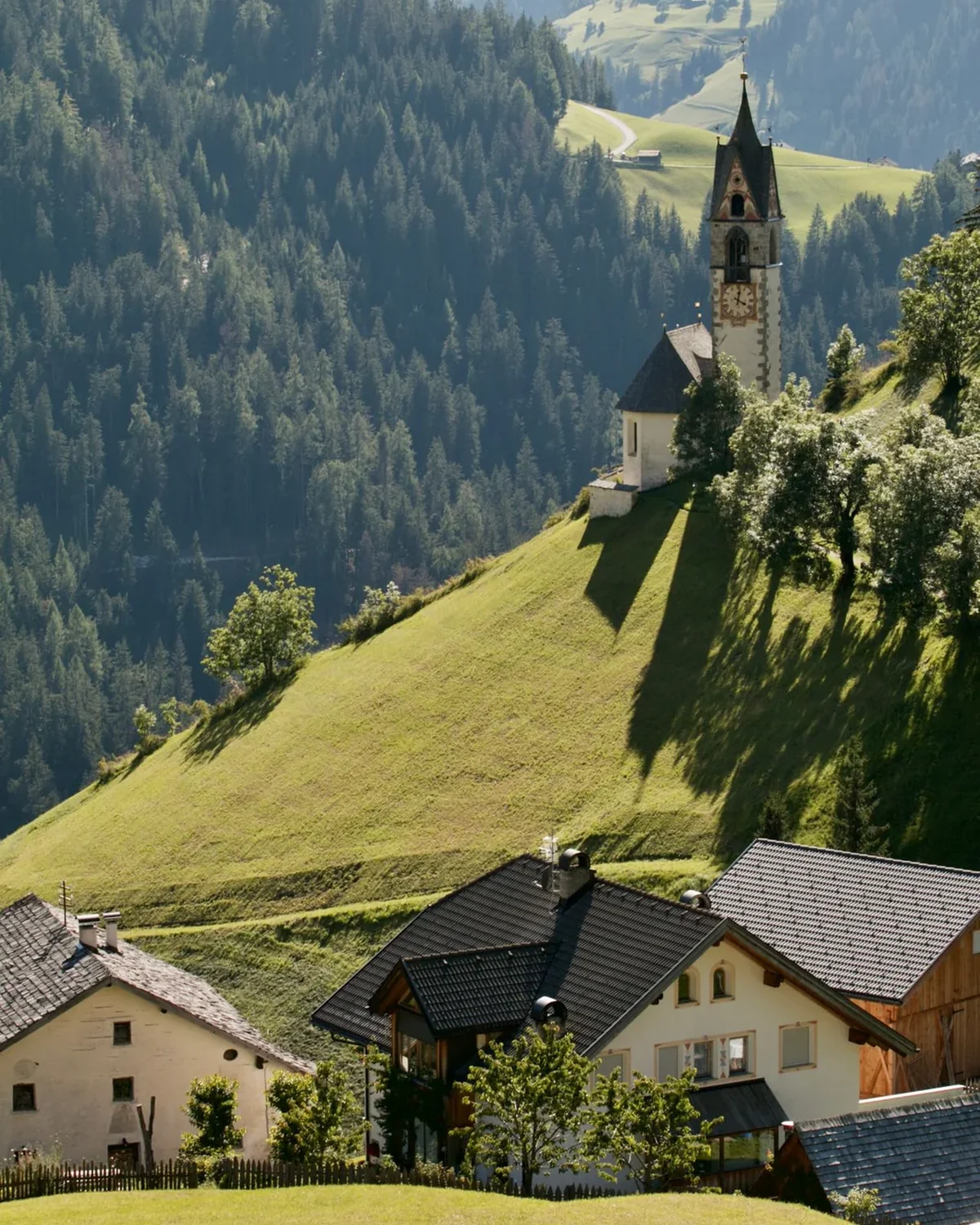 Small church in a green Alpine valley