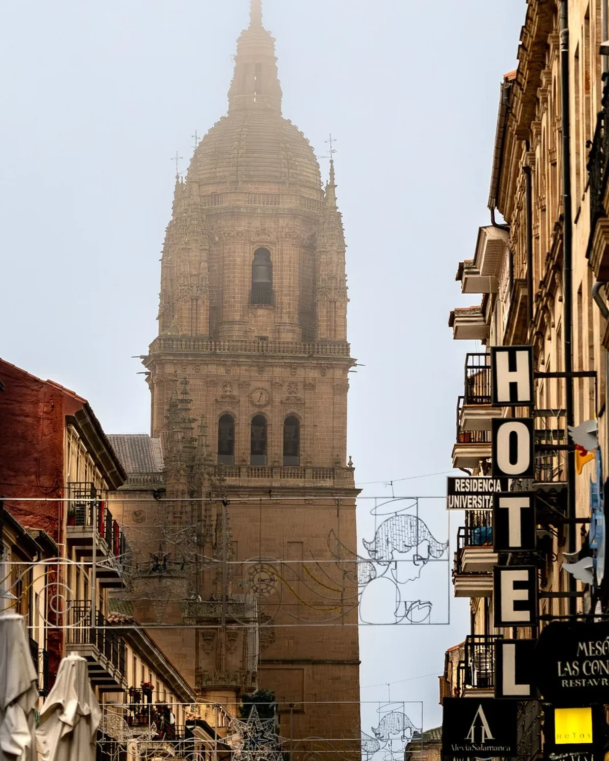 Historic European city street and cathedral tower