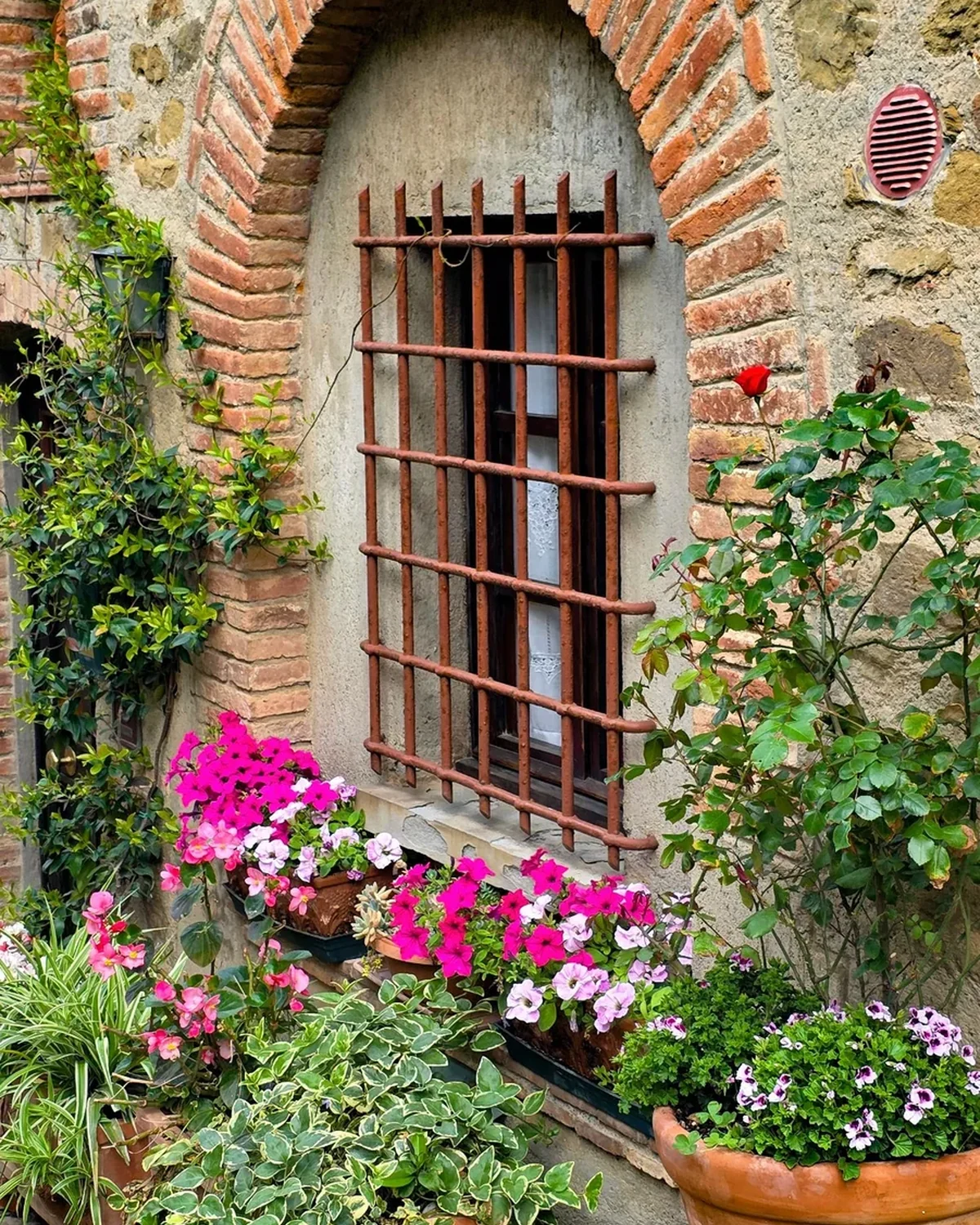Flowers outside a traditional Italian stone house